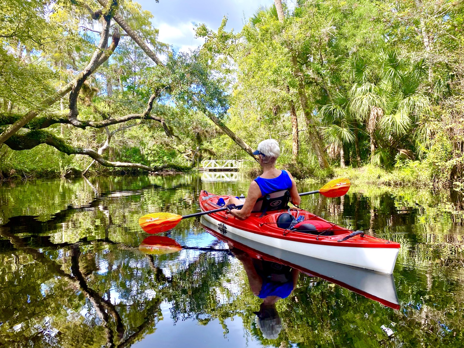 Kayaks gathered in the sunshine, the floating version of a porch visit.