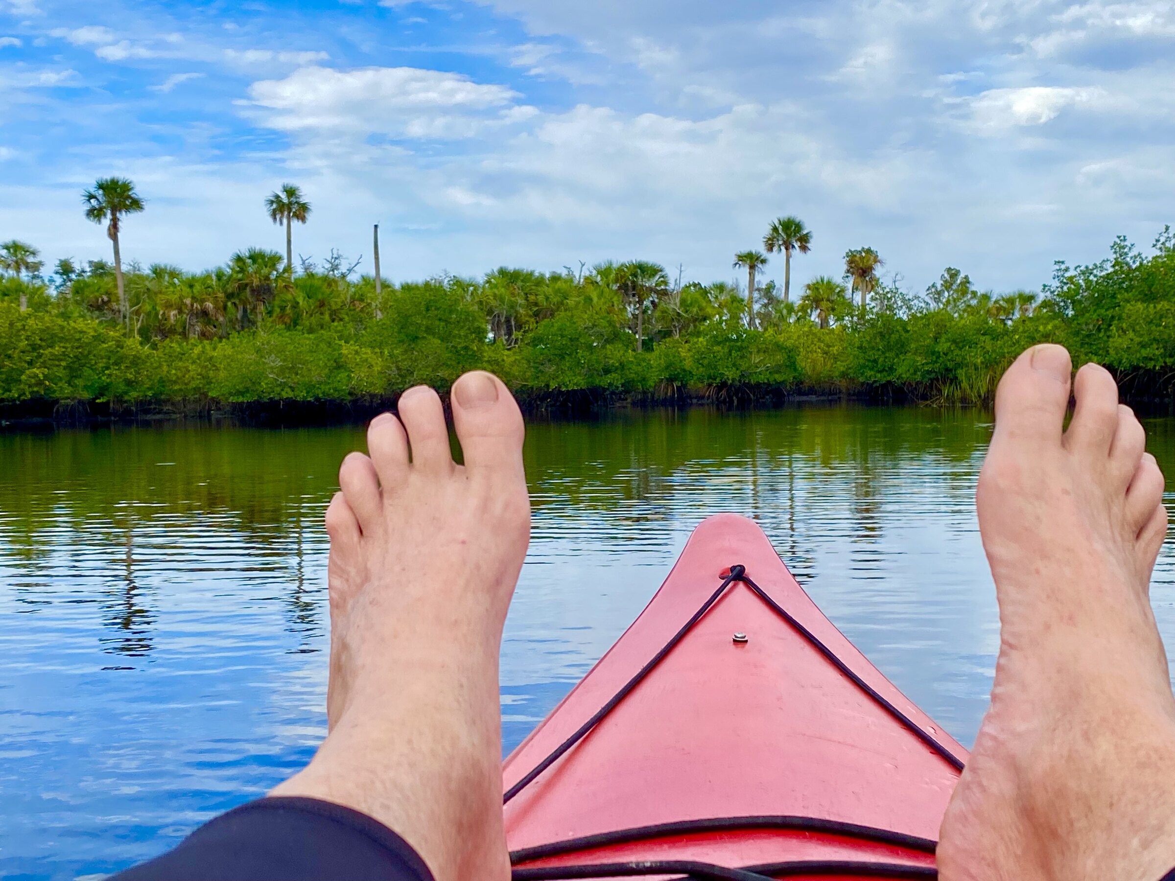 Tim relaxing in his red kayak