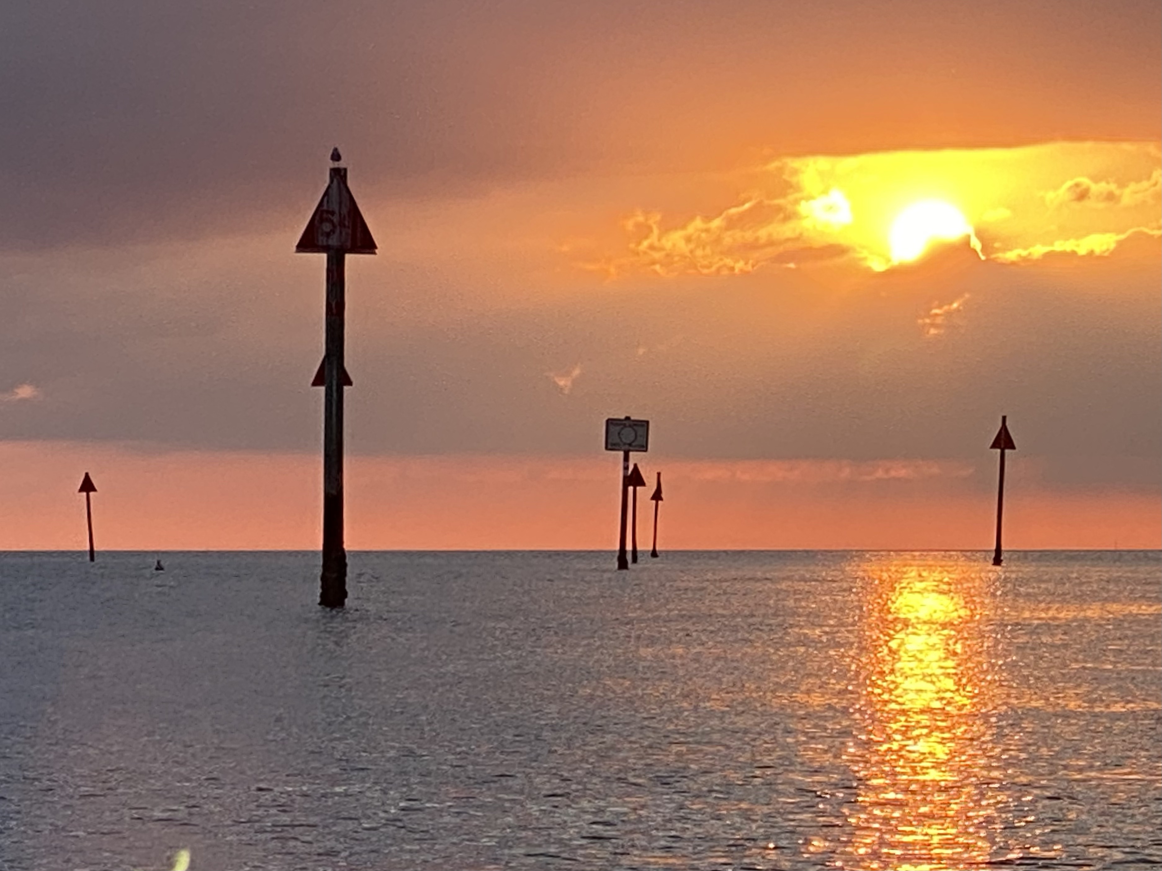 Sunset reflected between channel markers at Aripeka Harbor