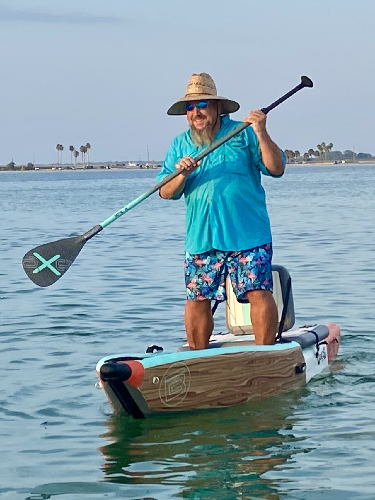 SUP paddler in blue