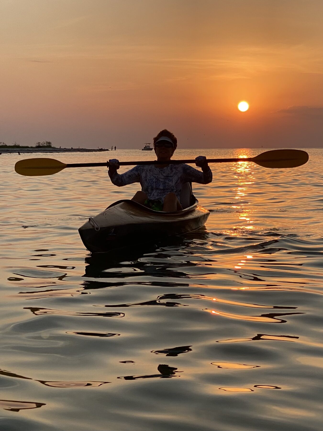 Kayaker sunset silhouette