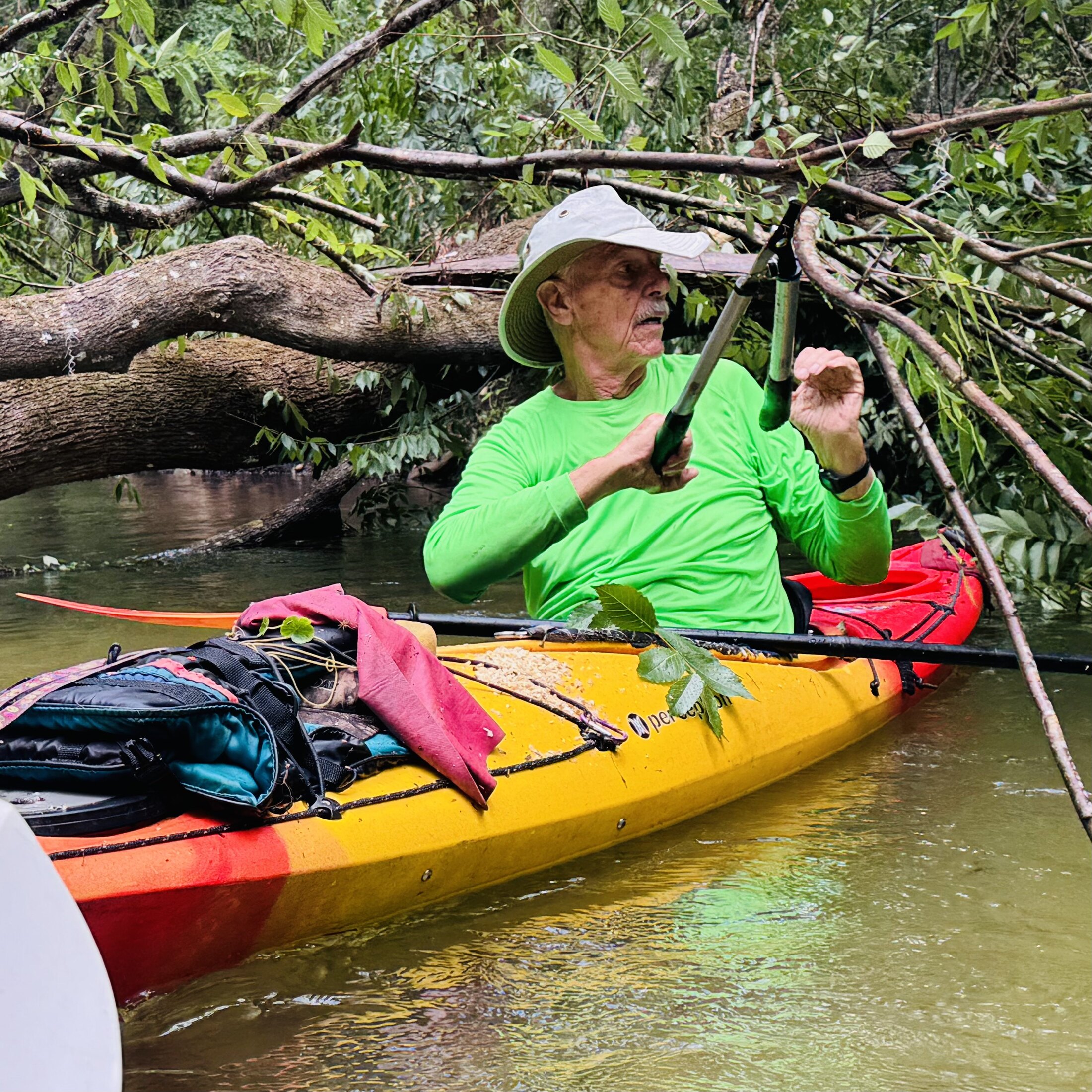 Gary carrying clearing tools in his kayak
