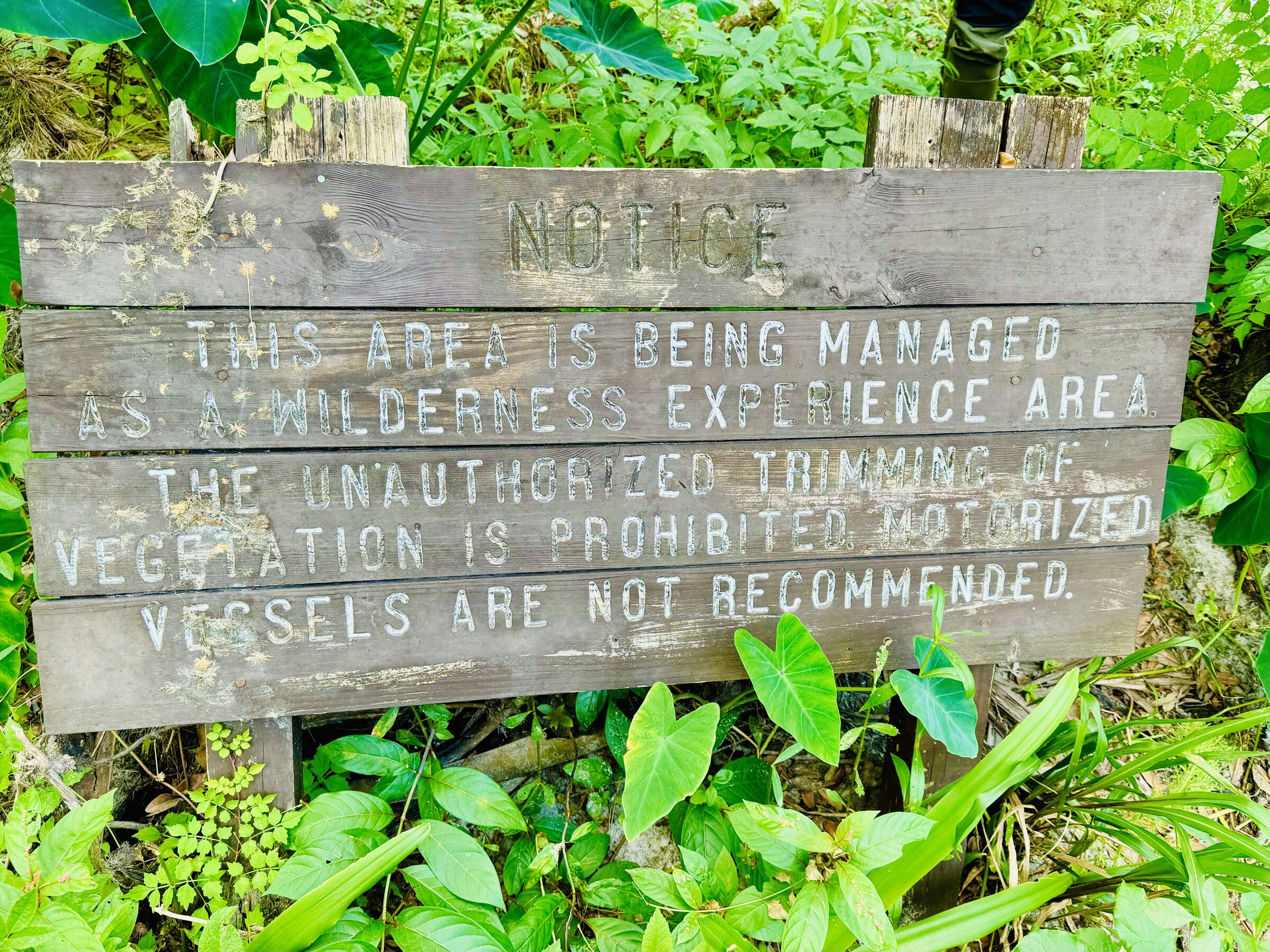 Weathered sign marking a former scientific area