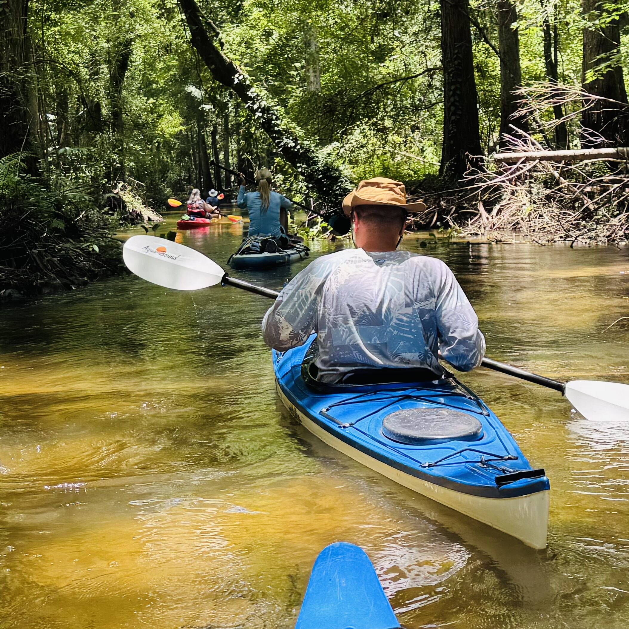 Paddler in a narrow shallow current