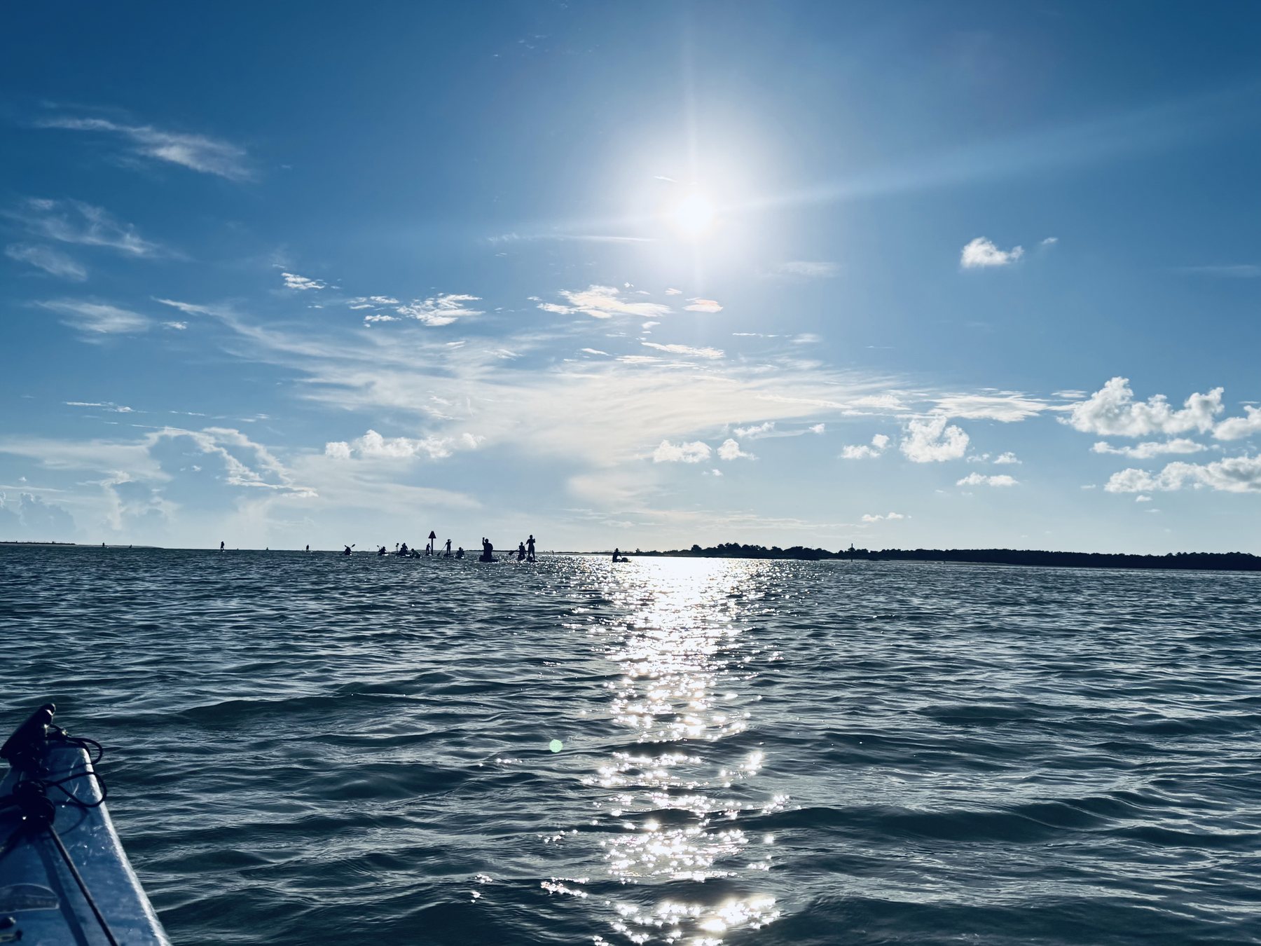 Photo #3: Paddlers heading west across the sunlit water toward Caladesi