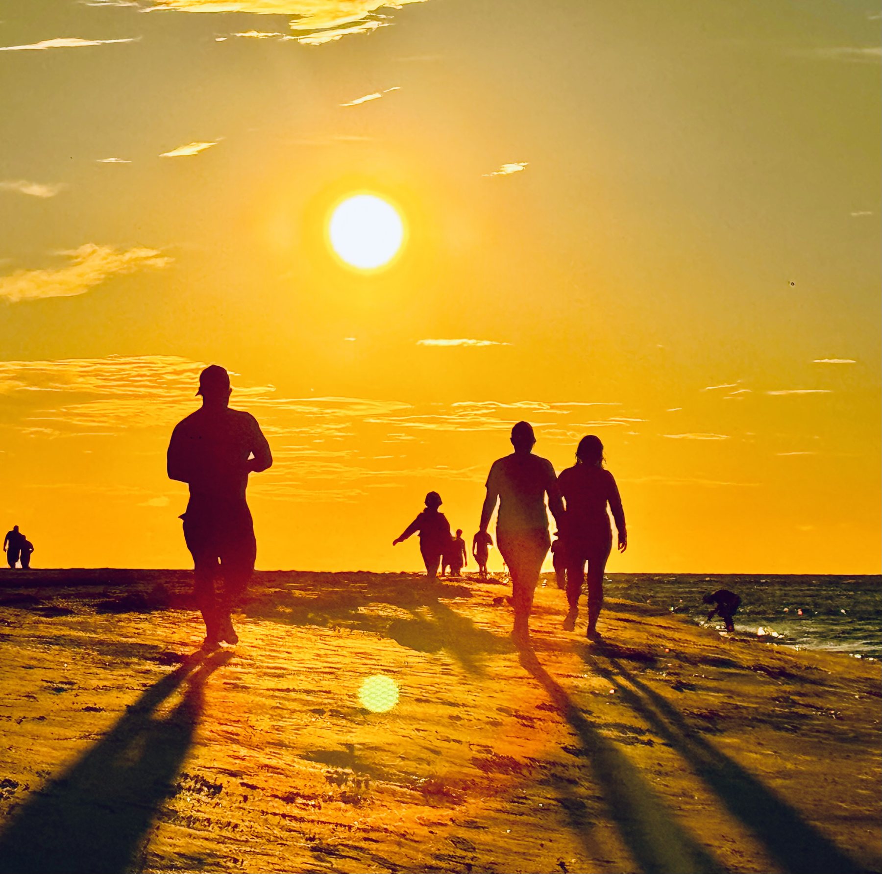 Photo #15: Friends gathered along the sandbar for the final light of day