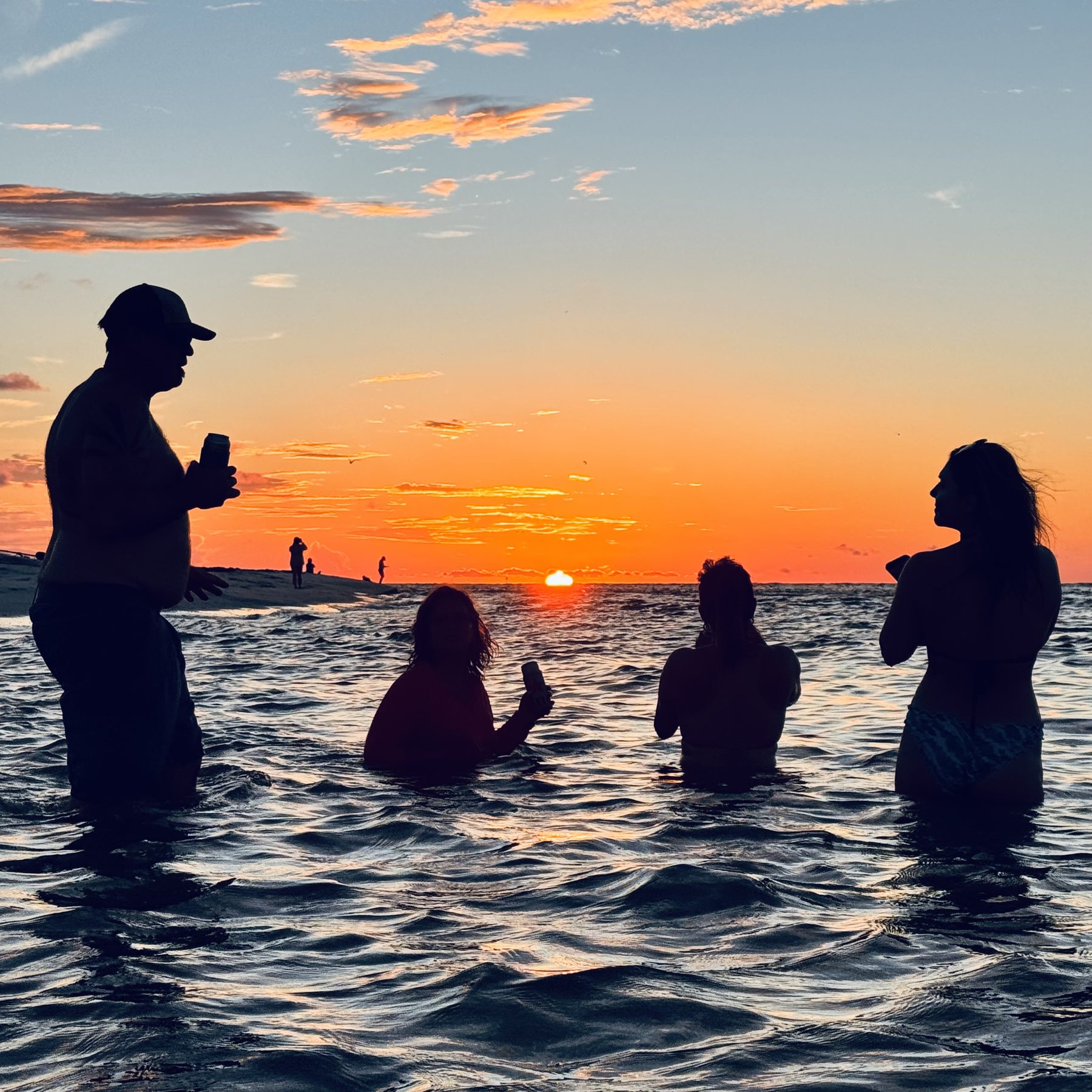 Photo #16: A sunset swim in the calm Gulf water beside Caladesi