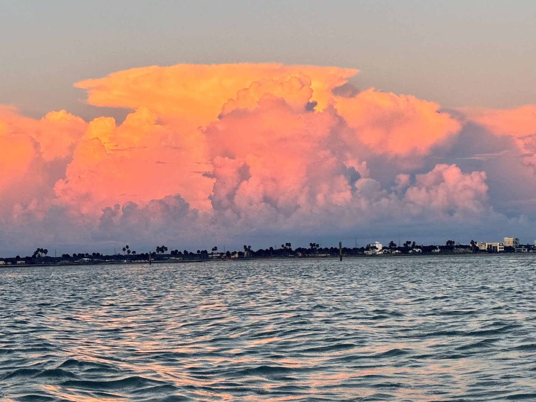 Photo #18: A towering storm cloud glowing pink beyond the Intracoastal Waterway