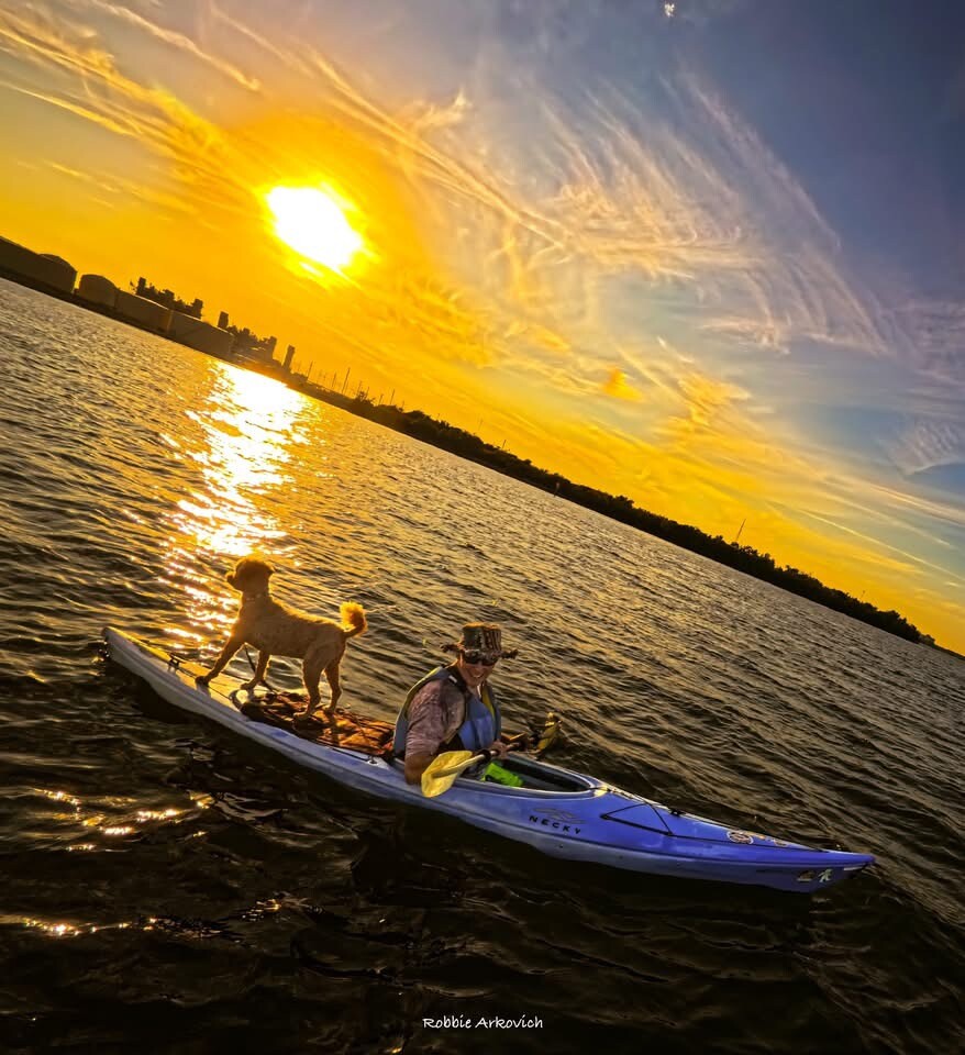 Buddyboy standing on the kayak