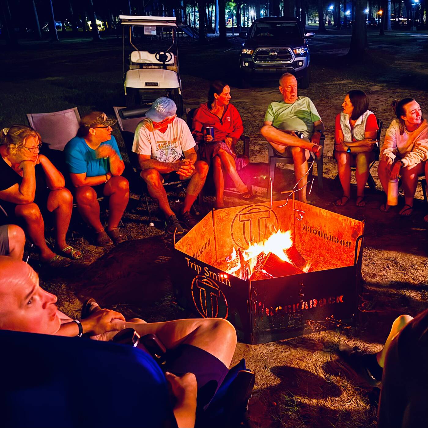 RockADock friends gathered around a campfire