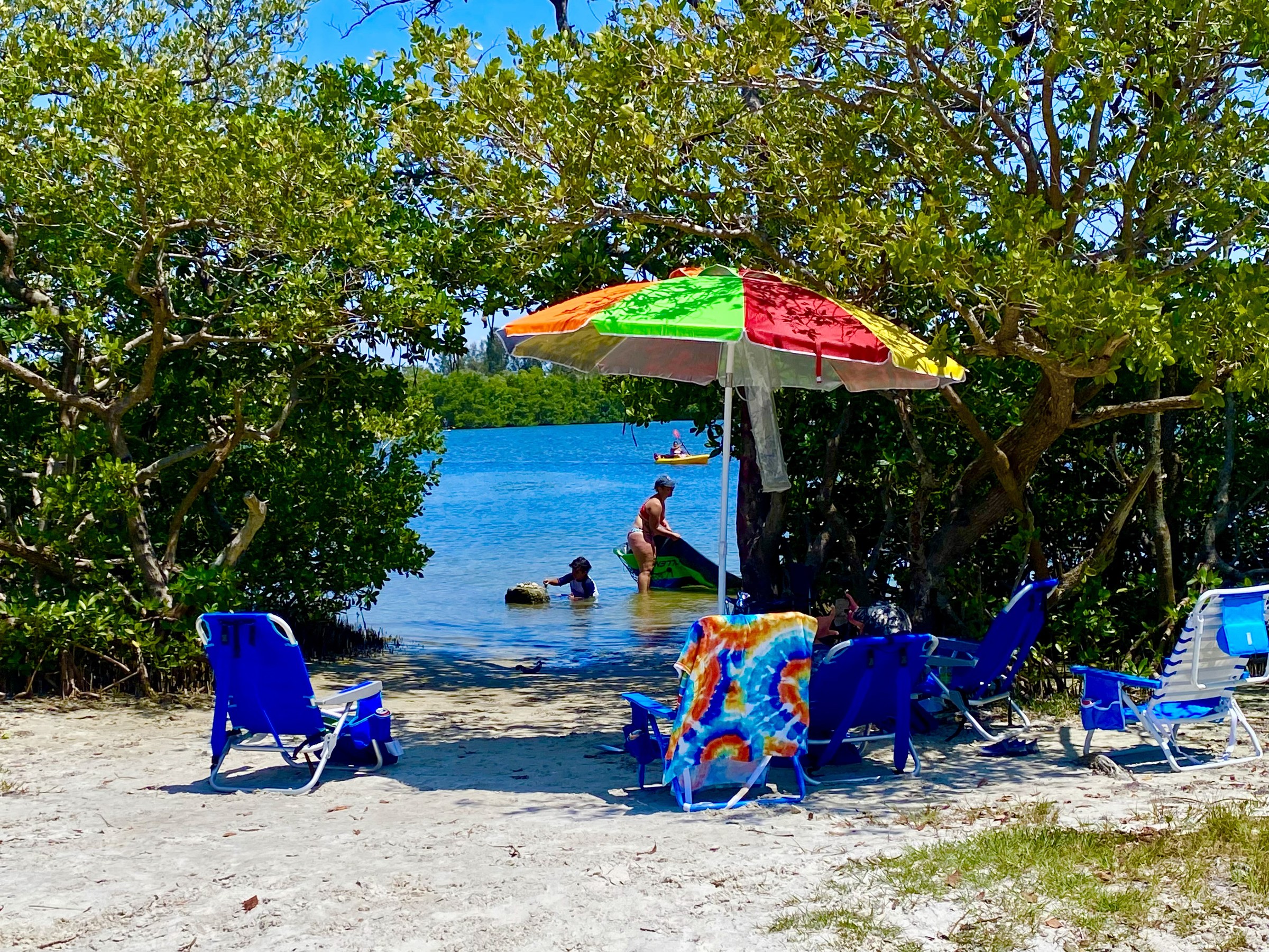 The beach and colorful waterfront setting at The Getaway near Gandy.