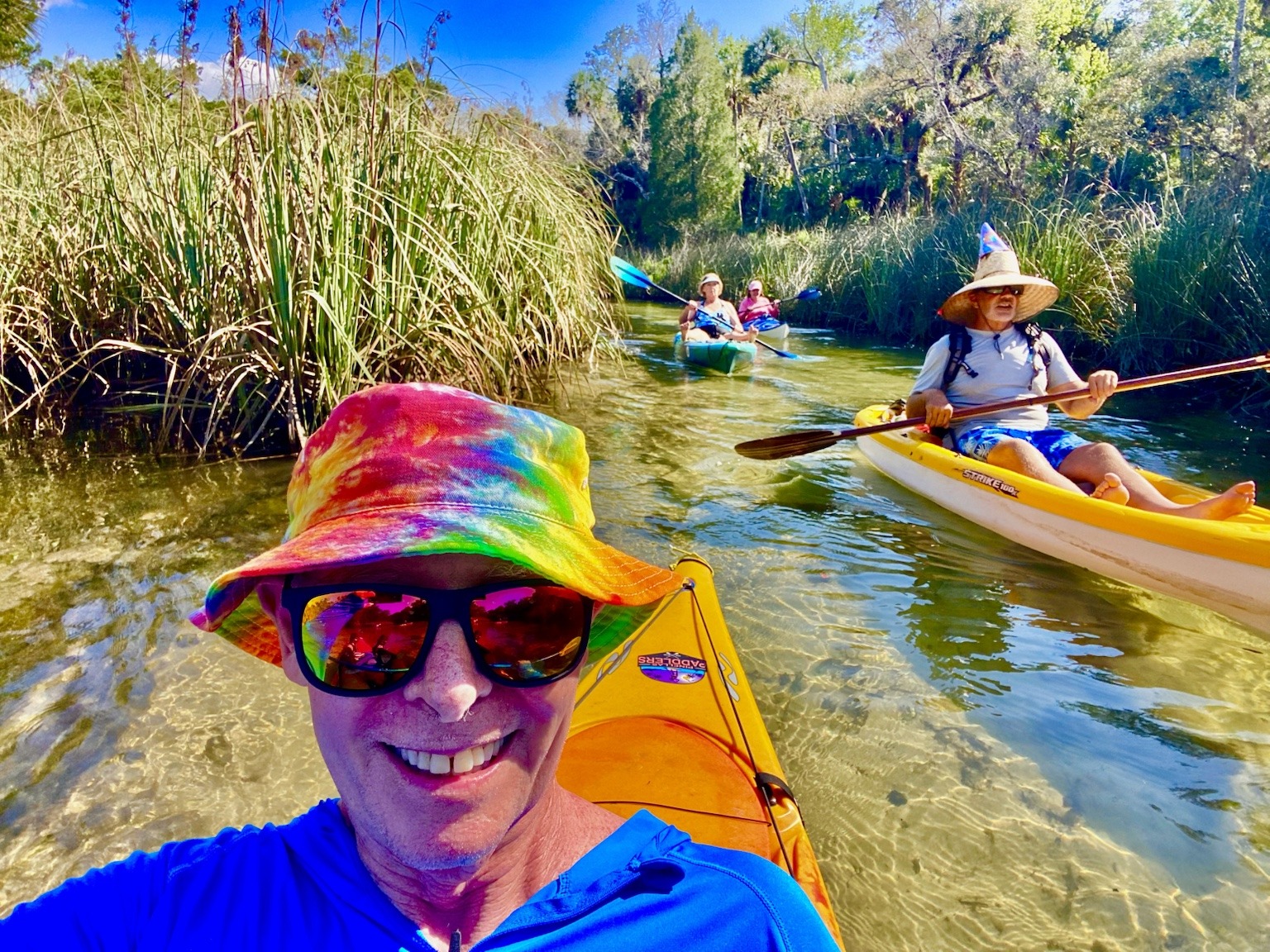Another happy birthday-paddle selfie while the group drifts through a narrower spring-fed channel.