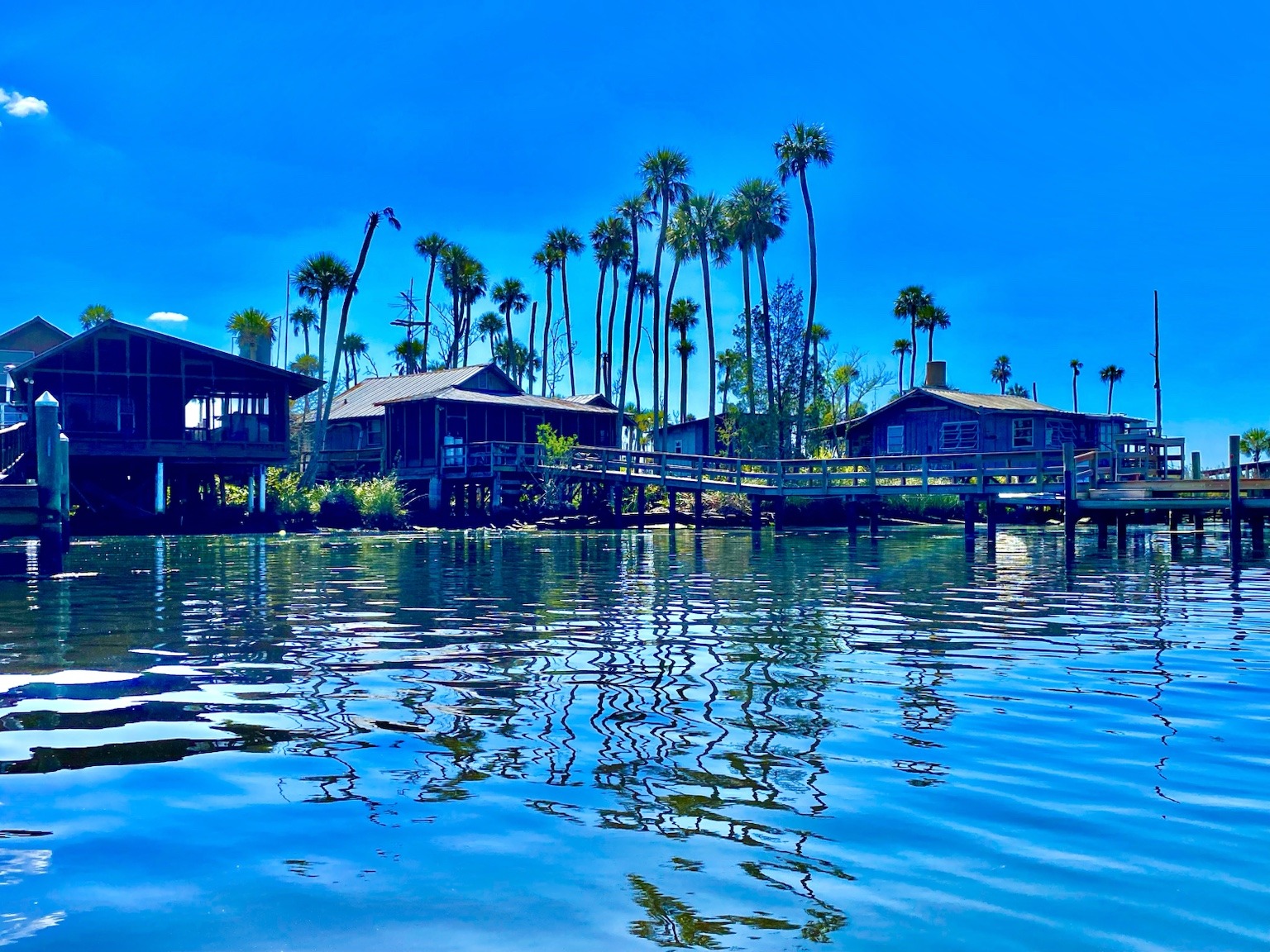 A quiet river house reflected in the calm water near the upper Chassahowitzka.