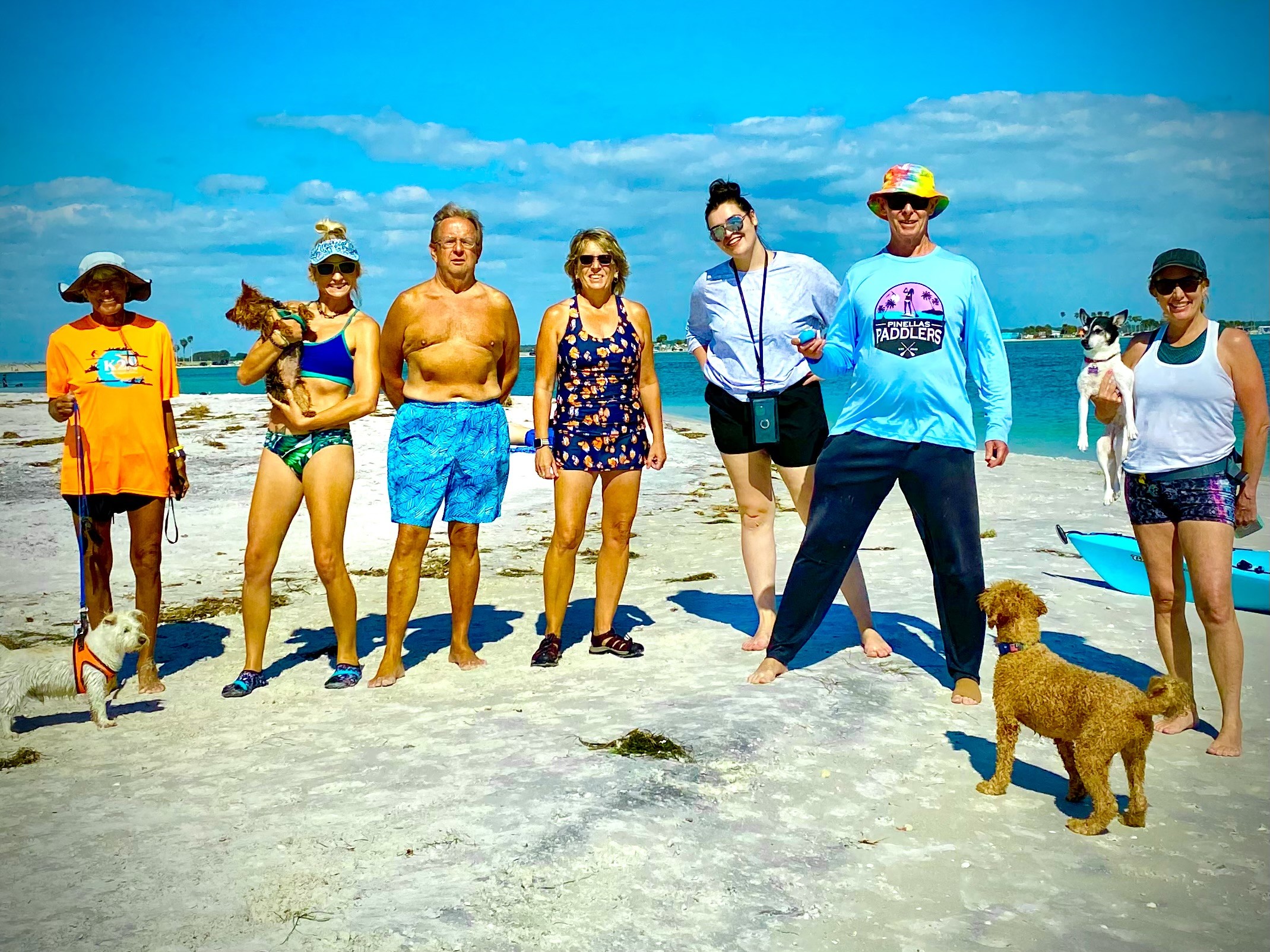 Pinellas Paddlers and their pups gathered together on the sandbar for a group photo.