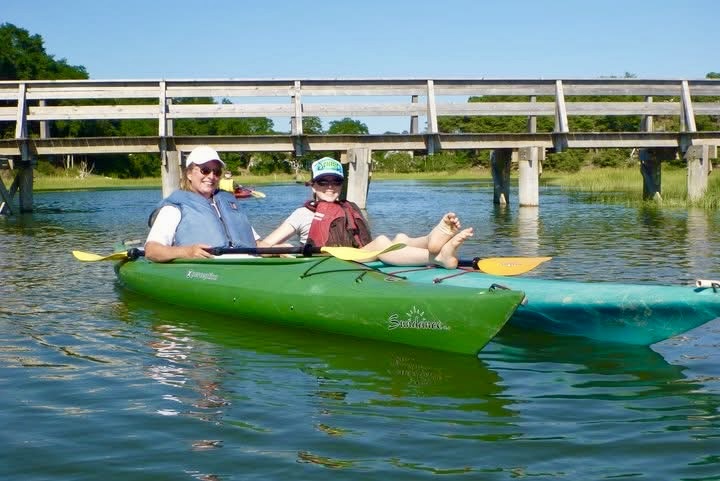 Kayakers beside Uncle Tim's Bridge