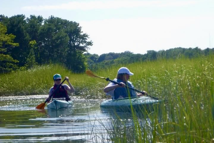 Kayakers entering the salt marsh