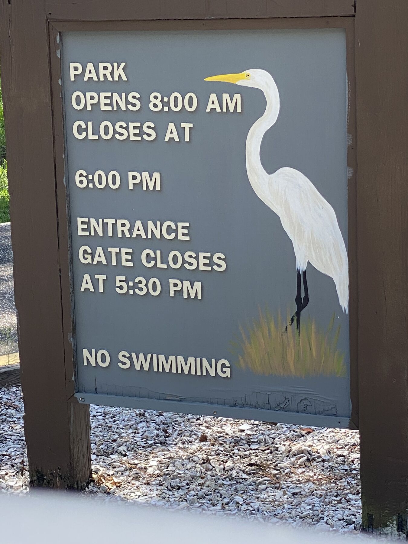 Park opening and closing hours sign