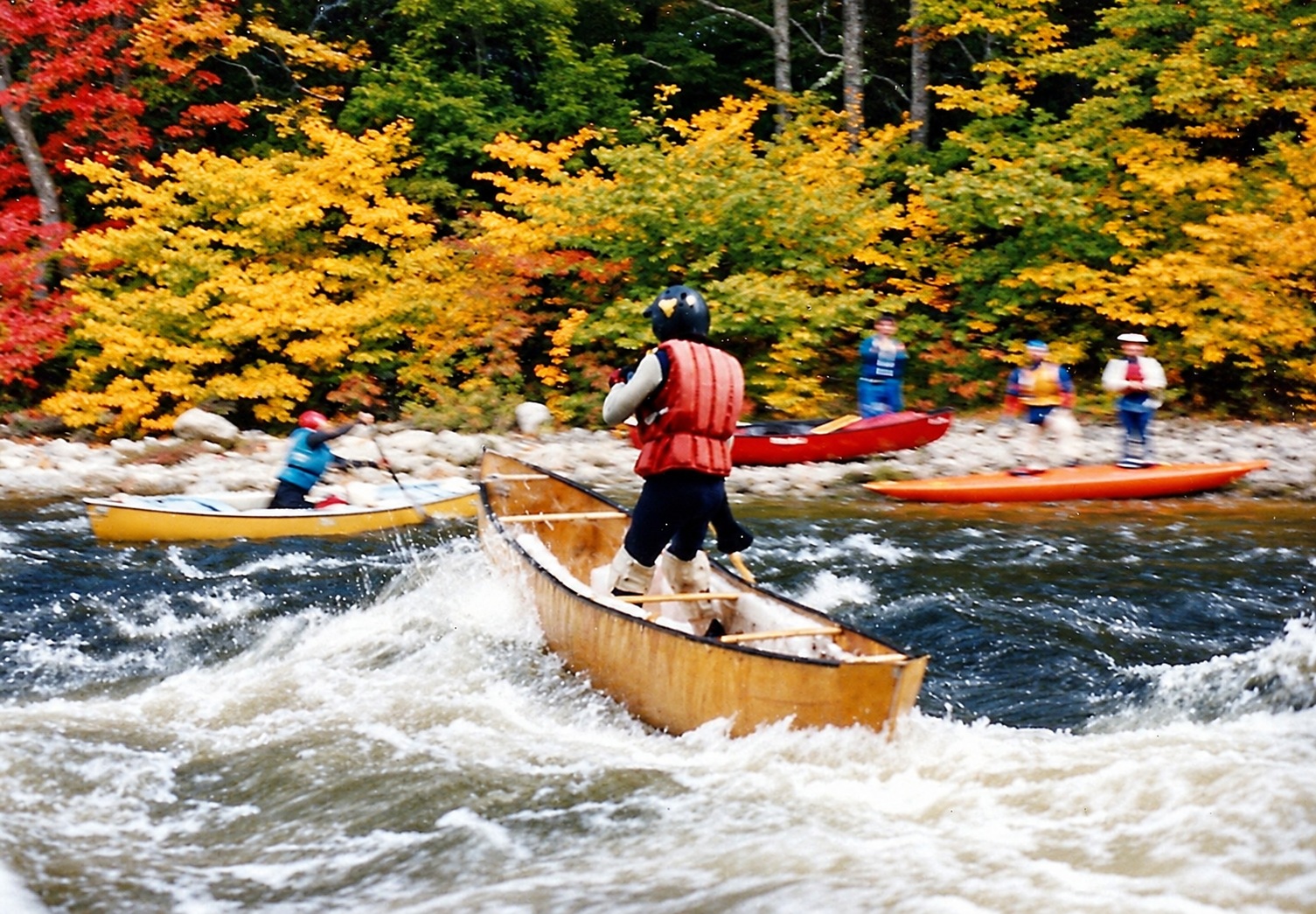 Vermont, 1990: a canoe running the waves, with other paddlers nearby.