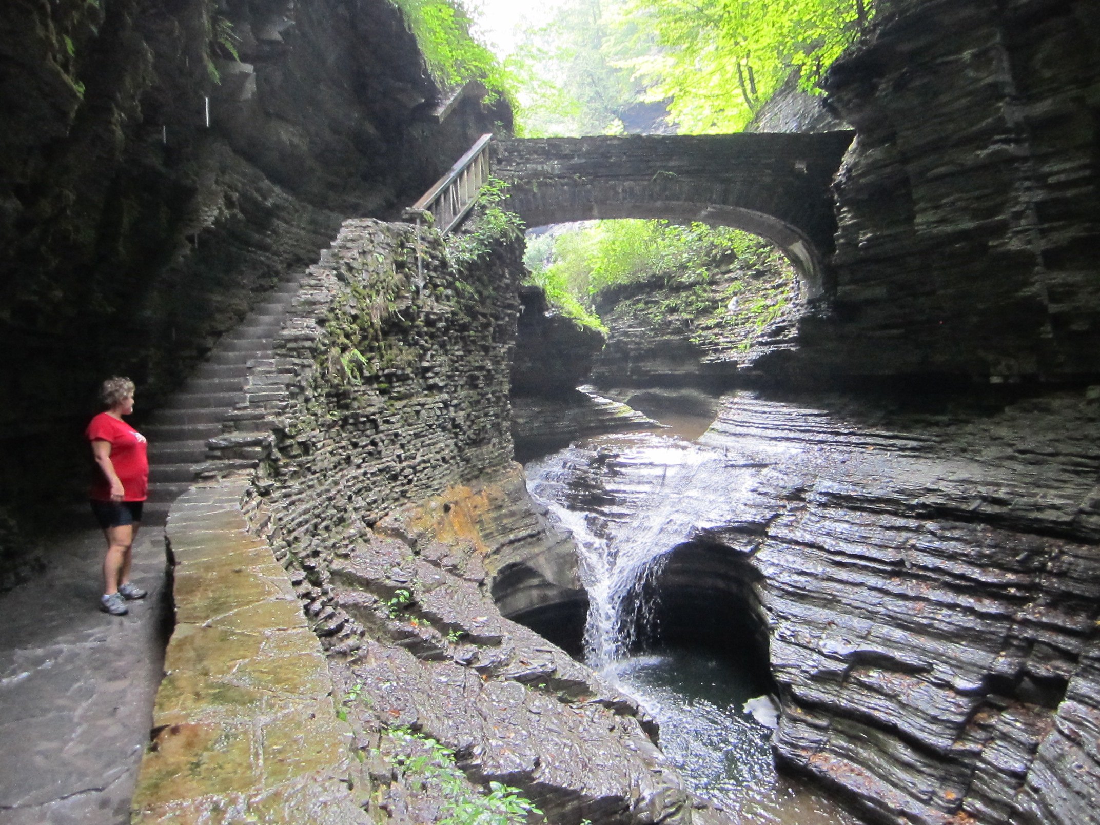 A natural pool and stone bridge deep inside Watkins Glen.