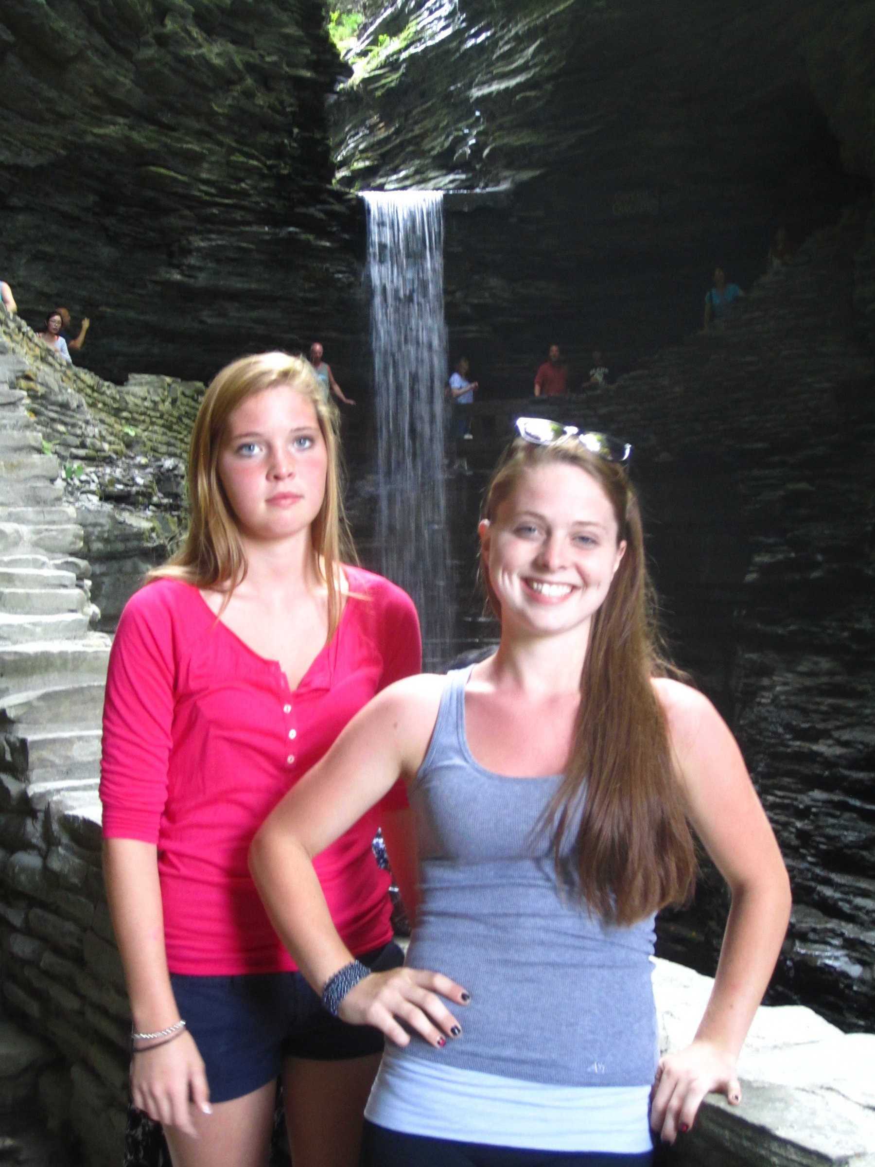 Brinlin and Delaney smiling together beside one of the falls.