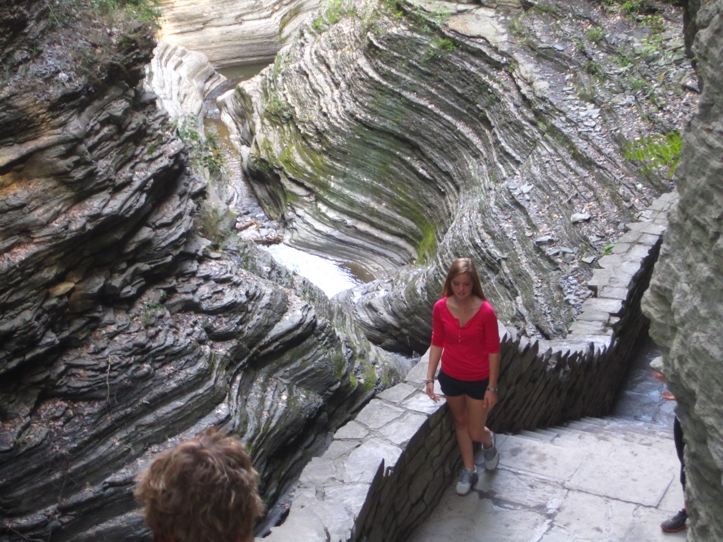 Curving rock walls polished and carved by flowing water.