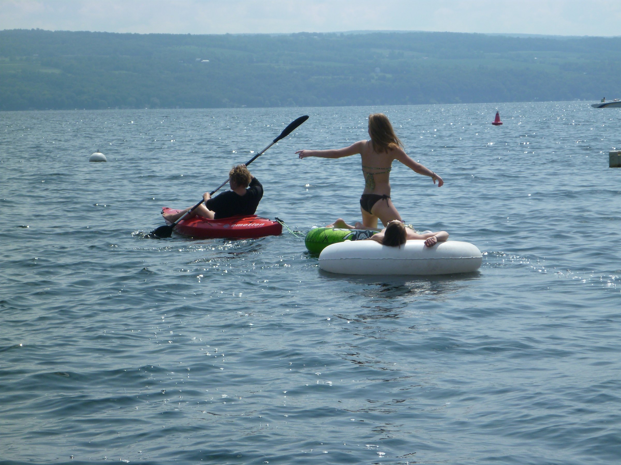 Kayaking alongside the raft during an afternoon on the lake.