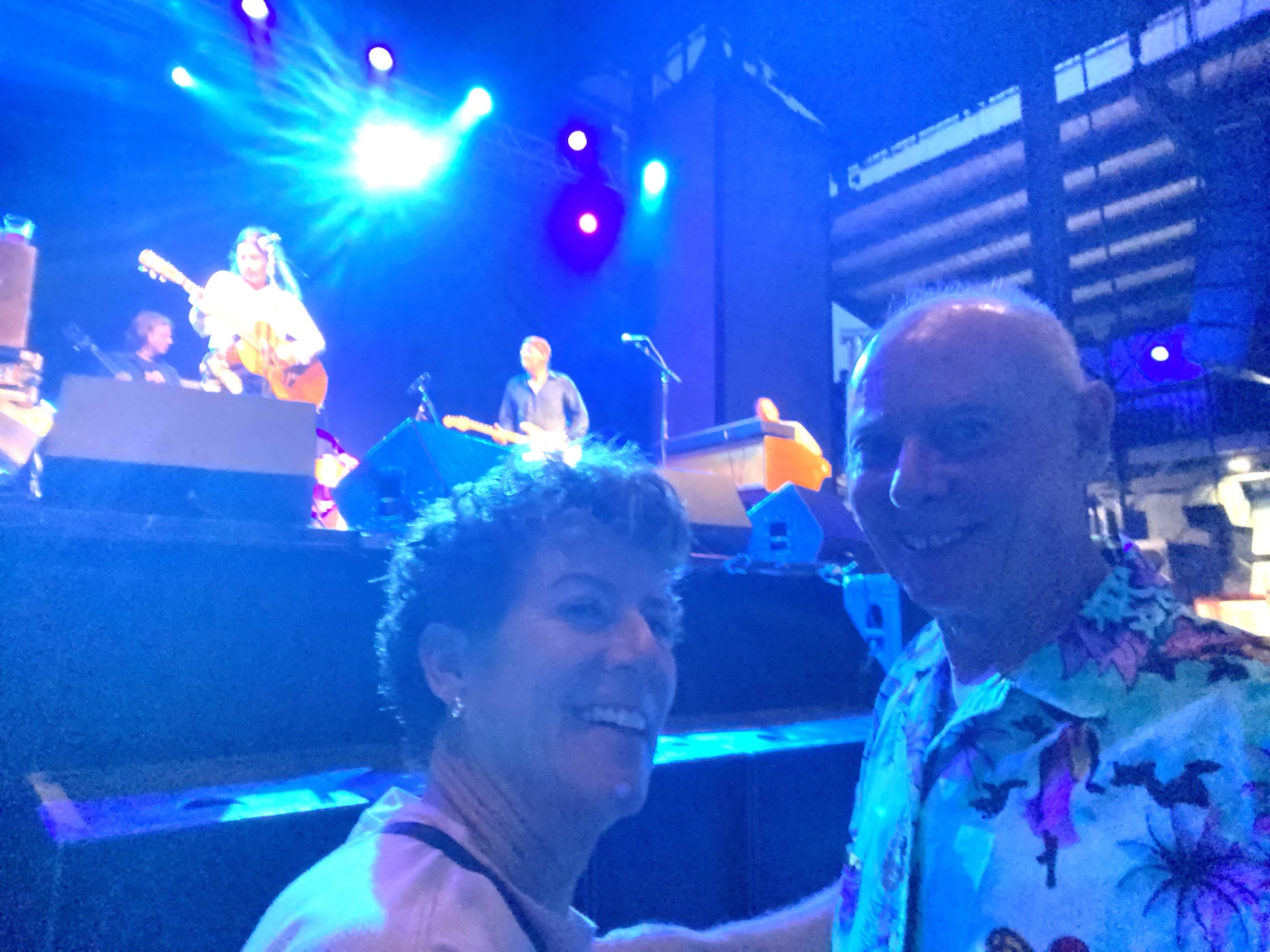 Standing close to the stage during a live performance.