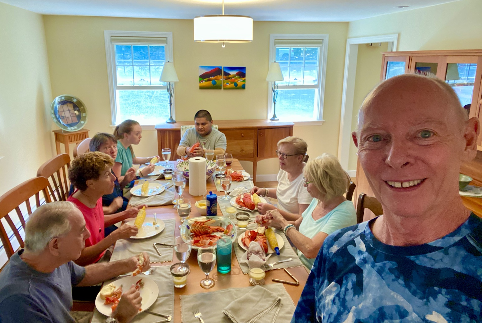 A lively family lobster dinner around the dining-room table.