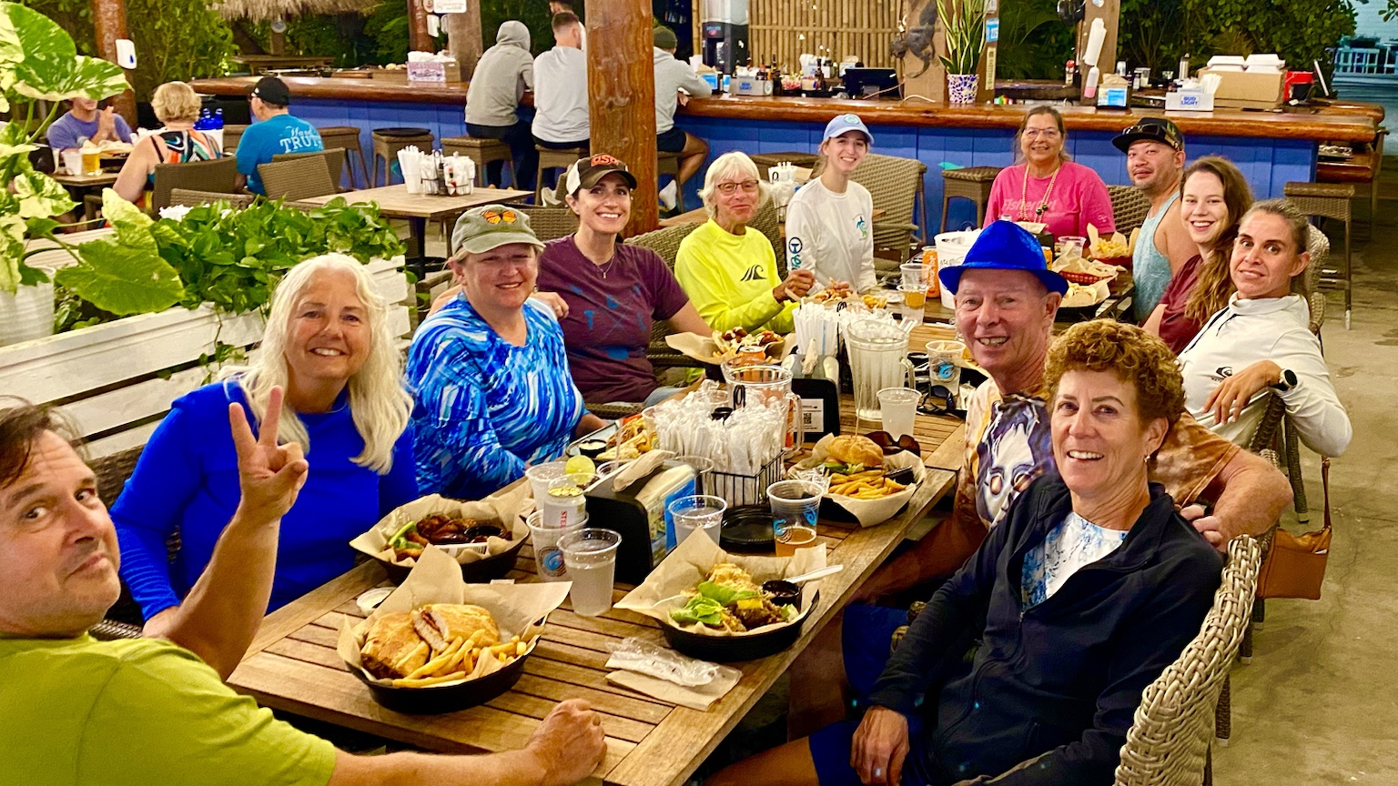A big post-paddle meal with friends gathered around a long table.