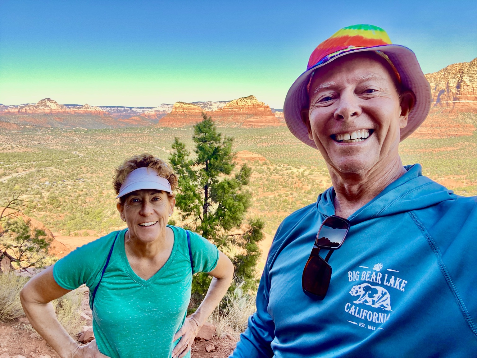 Another beautiful Sedona hiking view, with red cliffs and open country behind them.