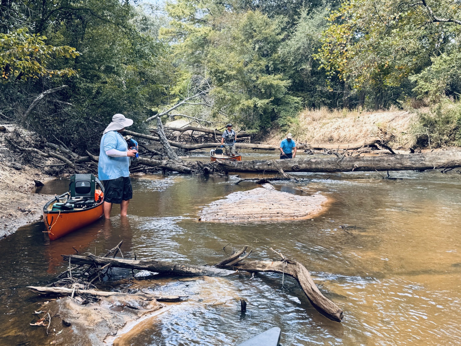 Paddler standing in shallow water